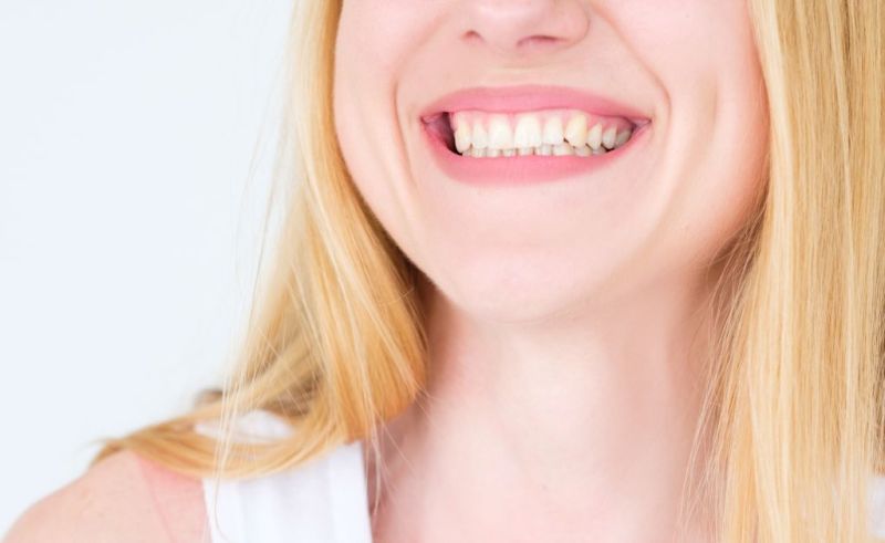 close up photo of a blonde woman smiling