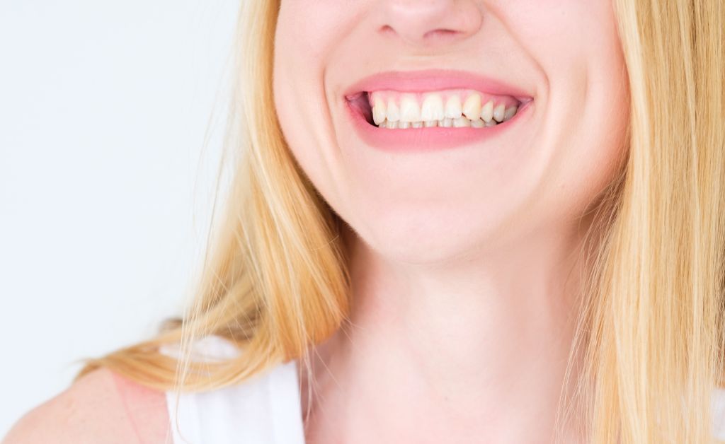 close up photo of a blonde woman smiling