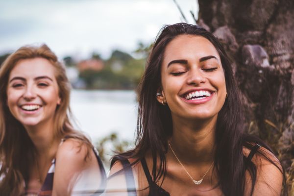 two young women smiling